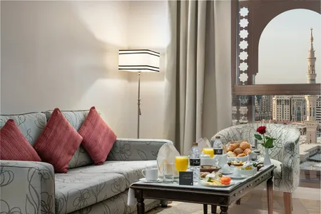 In-room breakfast tray in a suite with a minaret view