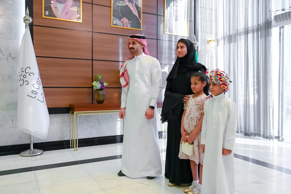 Saudi family photographed in a marble hotel lobby
